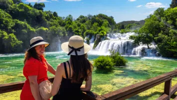 Two girls enjoying Krka Waterfalls
