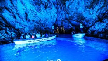 Boats inside Blue Cave in Croatia