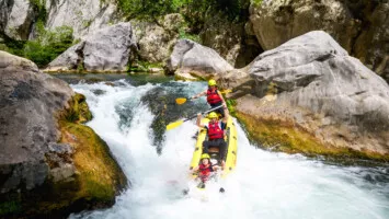 Sliding down the rapids on Cetina river day tour
