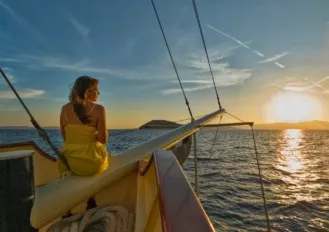 Girl enjoying sunset on Polaris boat in Split